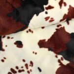 Velboa stof koeprint bruin zwart