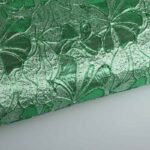 Jacquard bloem tone in tone lurex groen